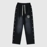 Black Hellstar waxed fleece sweatpants, featuring a front view with graphic logos and an adjustable drawstring.