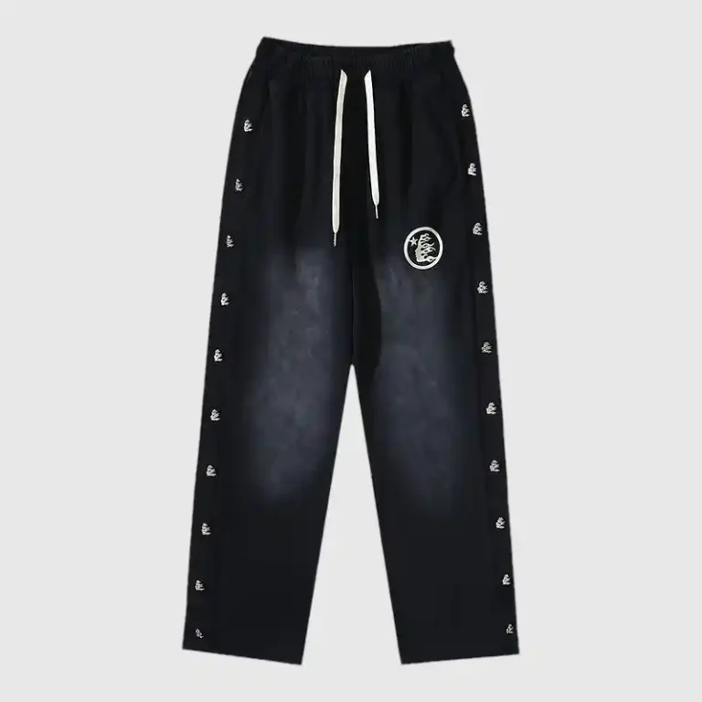 Black Hellstar waxed fleece sweatpants, featuring a front view with graphic logos and an adjustable drawstring.