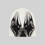 A crisp white Hellstar beanie featuring a bold black graphic design for a stylish and cozy urban streetwear look.