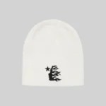 A soft white knit Hellstar beanie featuring a minimalist black embroidered graphic on the front for streetwear style.