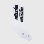 A pair of white Hellstar Classic Crew Socks featuring black branding and a comfortable ribbed cotton construction.