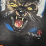 Hellstar Wolf T-Shirt featuring a detailed vintage-style screen printed graphic of a growling wolf on black cotton.
