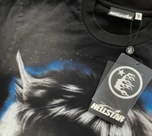 Close up of the Hellstar Wolf T-Shirt featuring a vintage washed black fabric, graphic print, and branded tag.