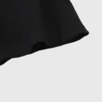 Close-up view of the sleeve detail on a black Hellstar Worship Hands graphic cotton streetwear t-shirt.