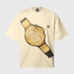 A cream Hellstar crew neck T-shirt featuring a detailed gold WWE Heavyweight Championship belt graphic on the front.