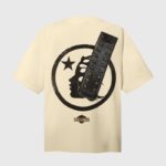 Back view of the cream Hellstar WWE Wrestlemania T-shirt featuring a black circular graphic with wrestling belt design.