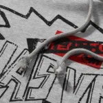 Close-up of the grey Hellstar x ComplexCon exclusive hoodie highlighting the unique graphic print and drawstring detail.