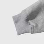 Close-up view of the high-quality ribbed cuff on the Hellstar x ComplexCon exclusive limited-edition grey hoodie.
